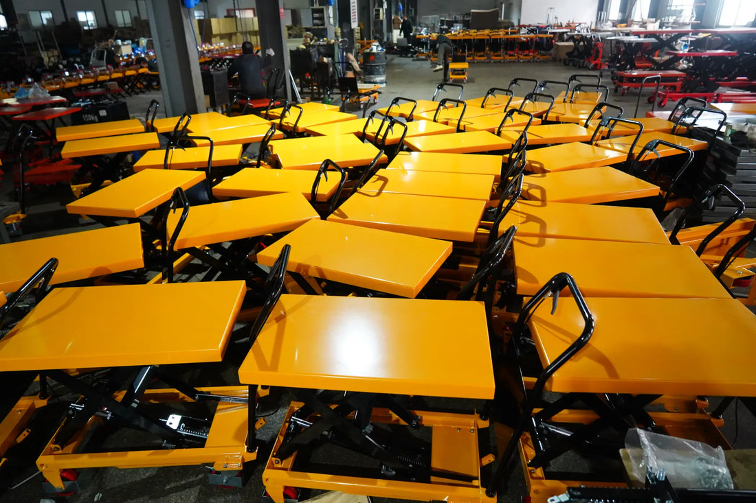 Heavy-duty hydraulic scissor lift tables in a manufacturing warehouse ready for global export.